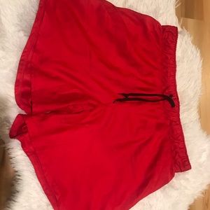 Red Nike shorts